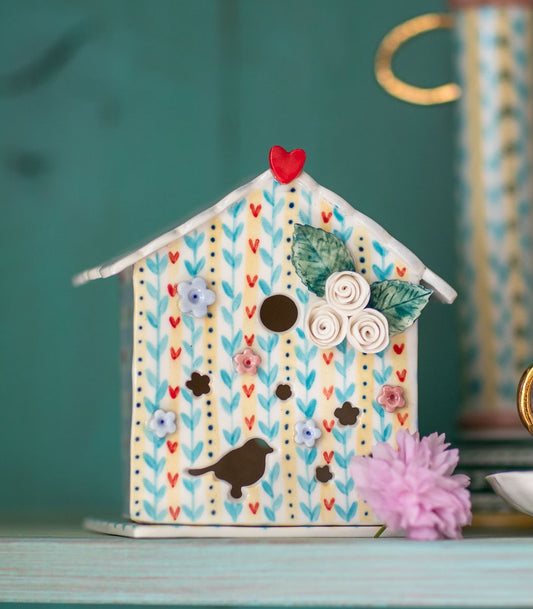 Bird house tea light holder