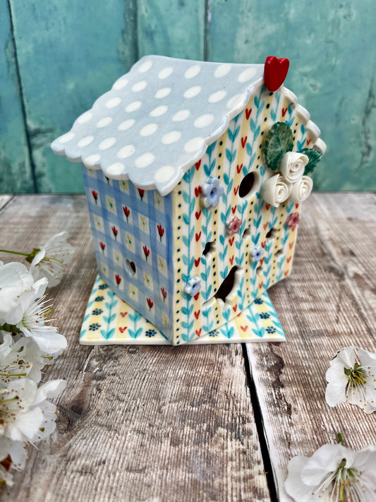 Bird house tea light holder